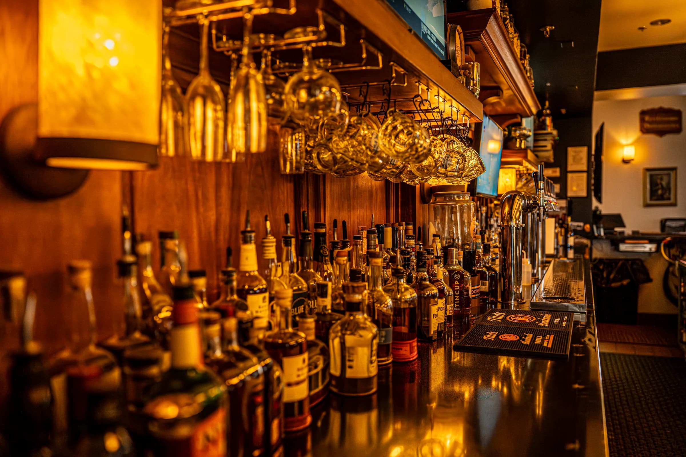 The back bar at Snowpack Taproom — 16 craft taps and a curated spirits and wine list, upstairs in Conifer, Colorado