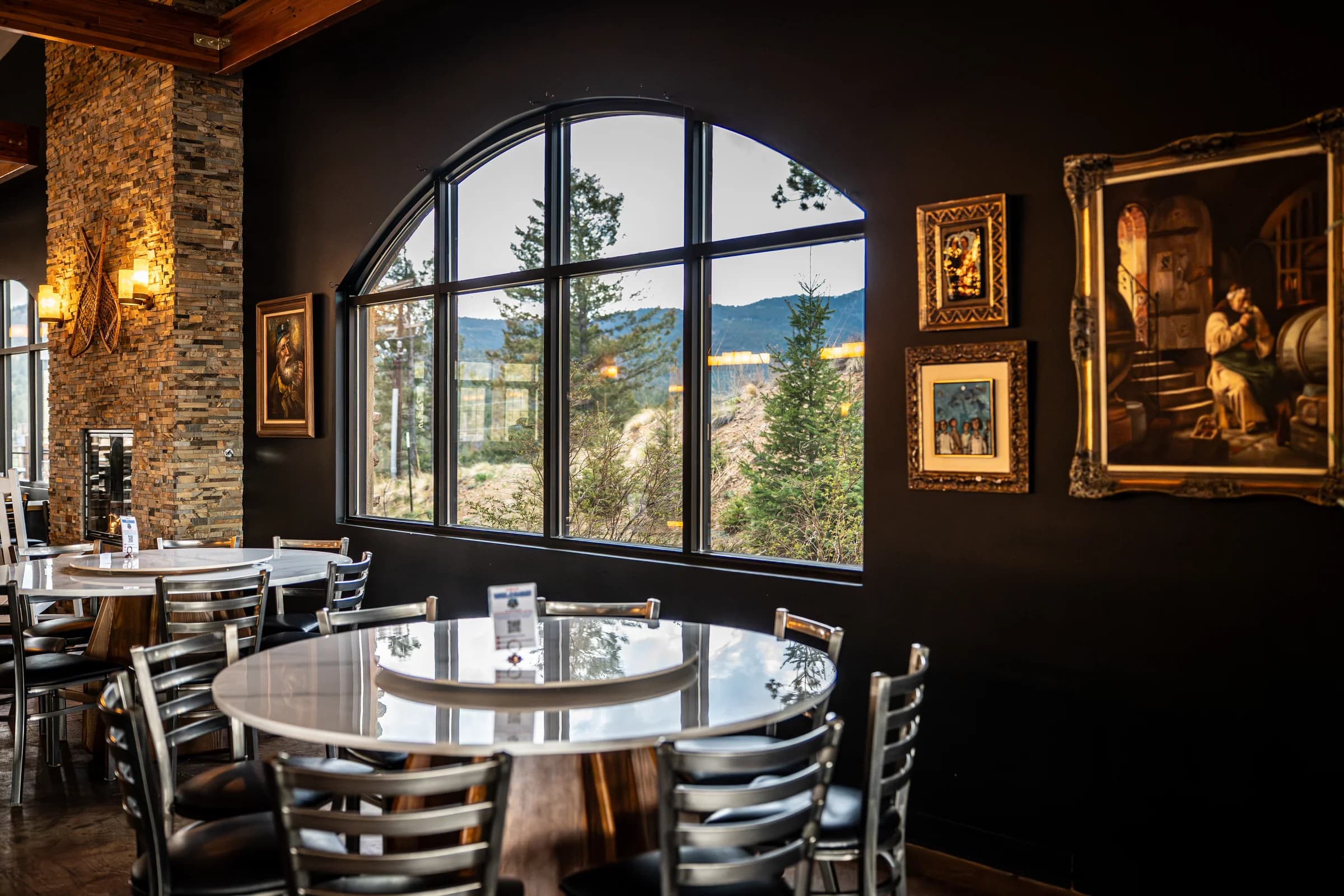 The Snowpack Pizzeria dining room with the brick oven in view