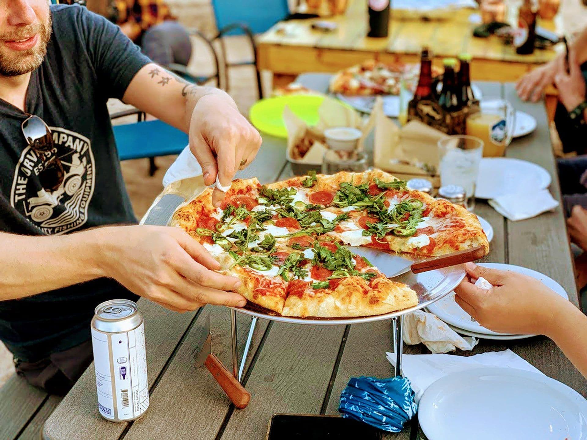A brick-oven pizza being served at Snowpack Taproom & Pizzeria in Conifer, Colorado