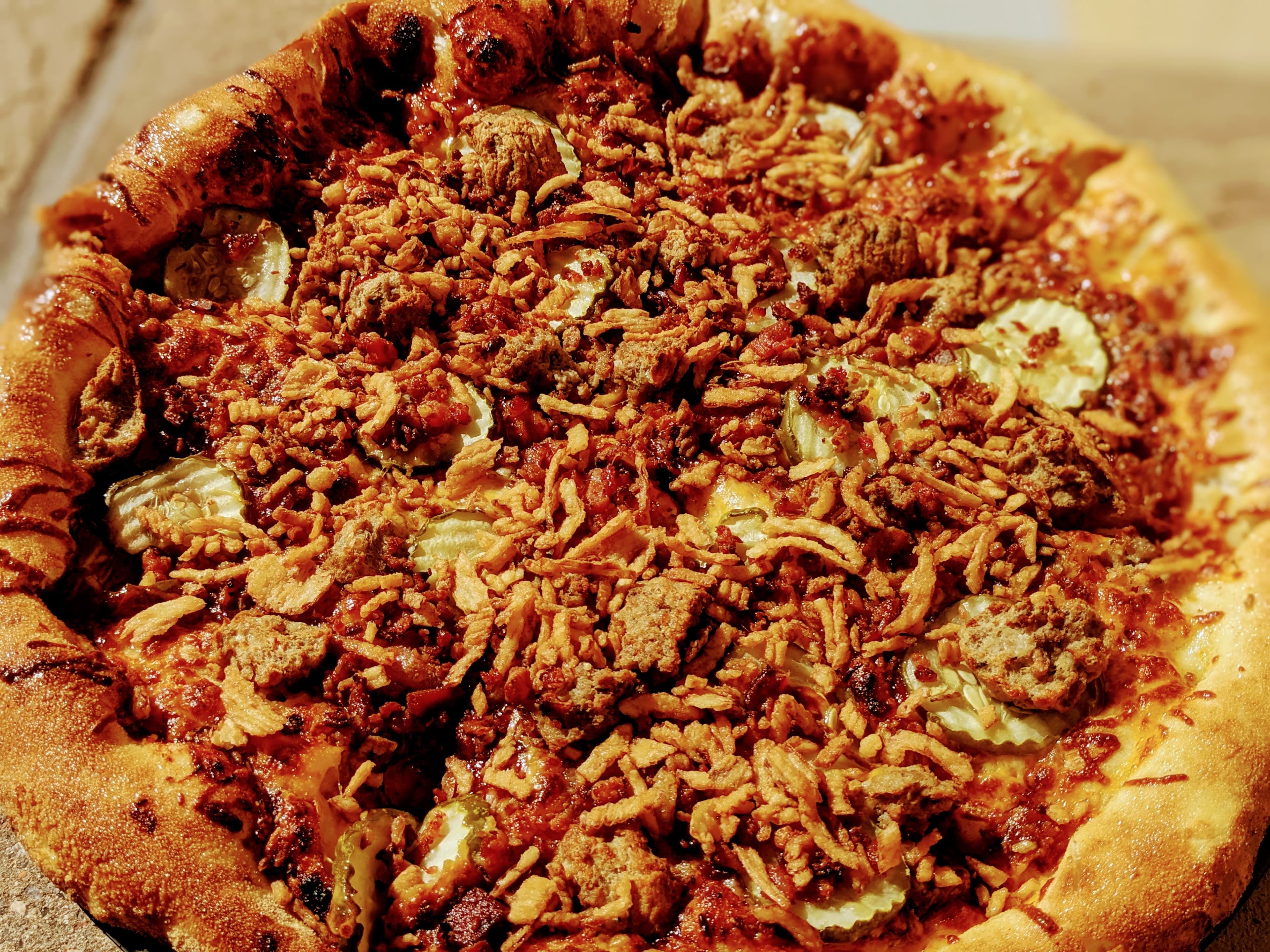 Brick-oven artisan pizza at Snowpack Pizzeria, the downstairs pizza room in Conifer, Colorado