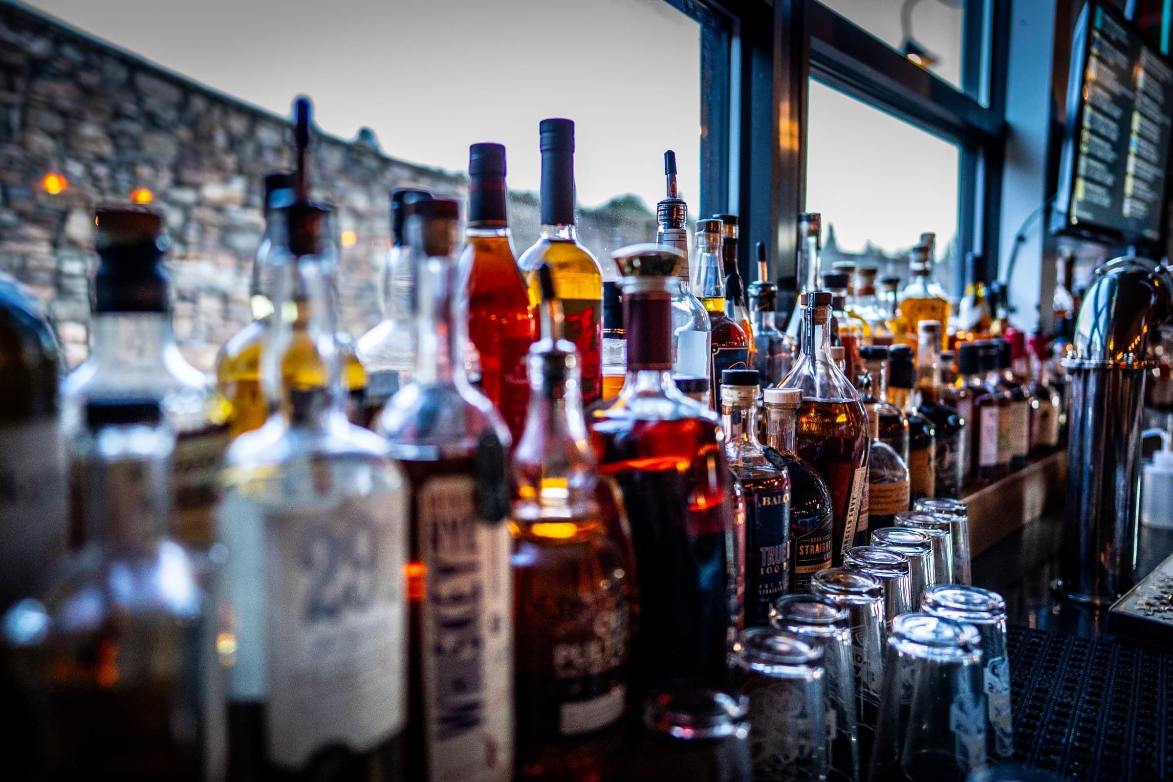 The full bar at Snowpack Taproom — craft spirits and a curated wine list, upstairs in Conifer, Colorado
