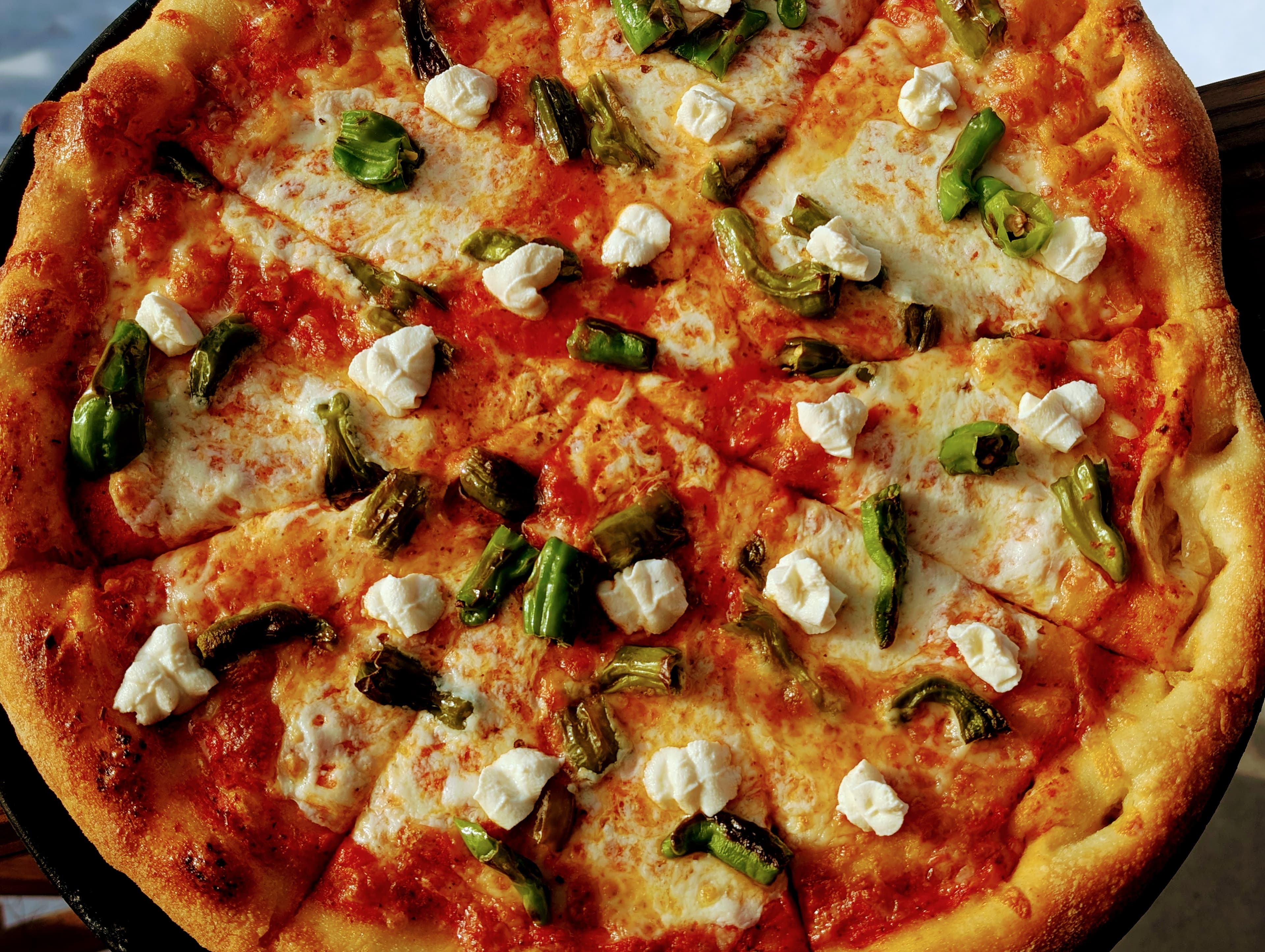 A second brick-oven artisan pizza at Snowpack Pizzeria in Conifer, Colorado